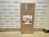 a cardboard box sitting on the floor in front of a wall