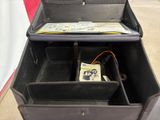 a black box with a bunch of papers inside of it