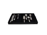 a black tray with silverware and spoons on it