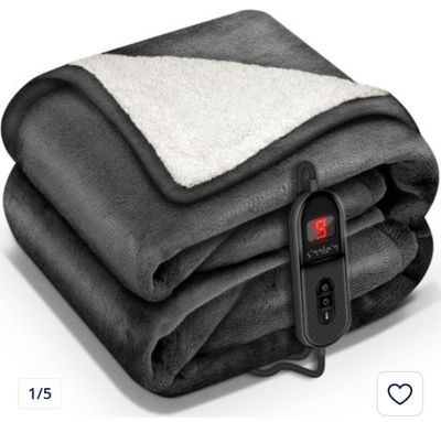 a close up of a blanket with a remote control on top of it