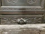 a metal door that has a decorative design on it