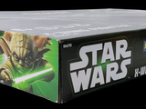 the box of the star wars trading card game has a light saber in it
