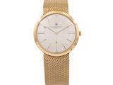 a close up of a gold wrist watch on a white background