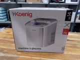 emballage d'une machine posée sur une table dans un magasin