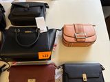 a lot of purses that are on a table