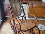 a rocking chair in the middle of a living room