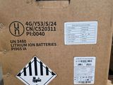 a cardboard box with a sticker on it sitting on a pallet