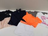 a lot of clothes that are on a table