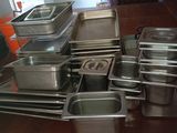 many pans on the table ready to be cooked