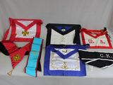 many masonic aprons laid out on a table