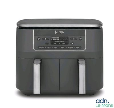 an air fryer with a digital clock on top of it