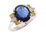 une bague ovale sertie d'un saphir bleu et d'un saphir jaune, rehaussée de diamants
