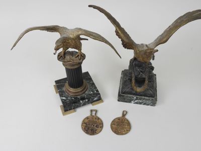 pair of bronze eagle figurines on marble bases with medallions