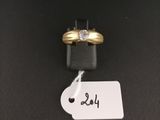 a close up of a gold ring with a diamond on top of it