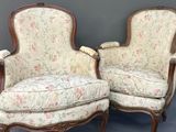 pair of antique french style chairs with floral upholstered upholstered cushions