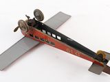 a toy airplane that is sitting on a white surface