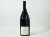 a bottle of wine that is sitting on a table