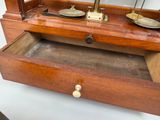 a wooden box that has a scale in it