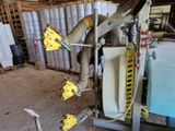 une machine sur laquelle se trouve une grappe de bananes