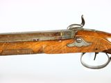 a close up of a rifle on a white background with a white background