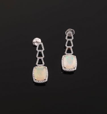 a pair of oplite and diamond earrings