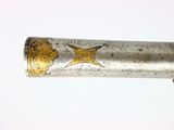 a silver and gold pen with a star on it