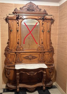 une armoire en bois surmontée d'un miroir