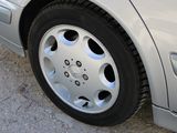 a close up of a car tire on the side of the road