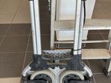 a hand truck that has wheels on it in a room