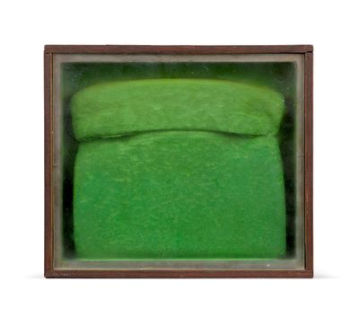 a green box with a pair of shoes inside of it