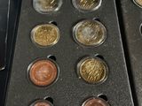 a lot of coins in the case on the table