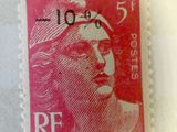 a close up of a stamp with a woman ' s face on it