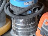 many different types of vacuum cleaners in this room