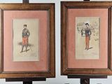 two framed prints of men in military uniforms are on a table