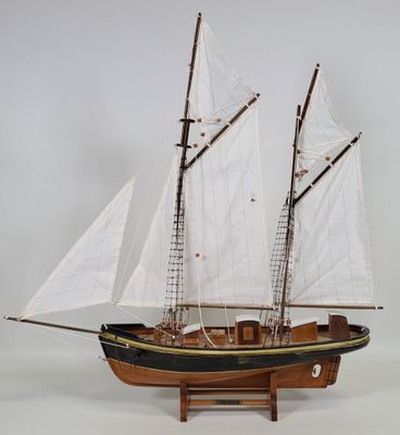 a model of a sailboat on display on a table
