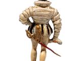 figurine of a man in armor with a sword and a helmet