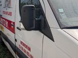 a white van that is parked on the side of the road