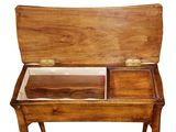 a wooden table with a wooden top and a drawer on it
