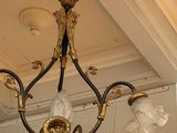 a chandelier hanging from the ceiling in a room