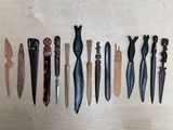 several different types of knives are lined up on a table