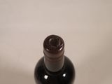 a bottle of wine that is sitting on a table