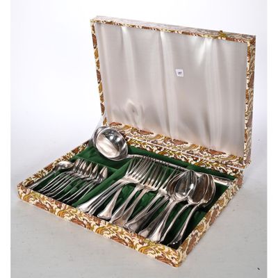 a box with silverware in it on a white surface
