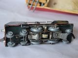 a toy train sitting on a table next to a box