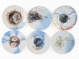 six plates with different designs on them on a white surface