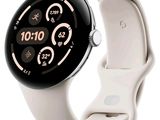 a close up of a smart watch on a white surface