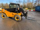 a close up of a forklift parked in a parking lot