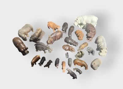 a lot of different animal figurines on a white surface