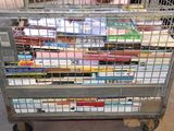 a metal cart with many books on top of it