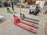 a forklift in the middle of a warehouse with other equipment