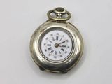 a small silver pocket watch with roman numerals on it